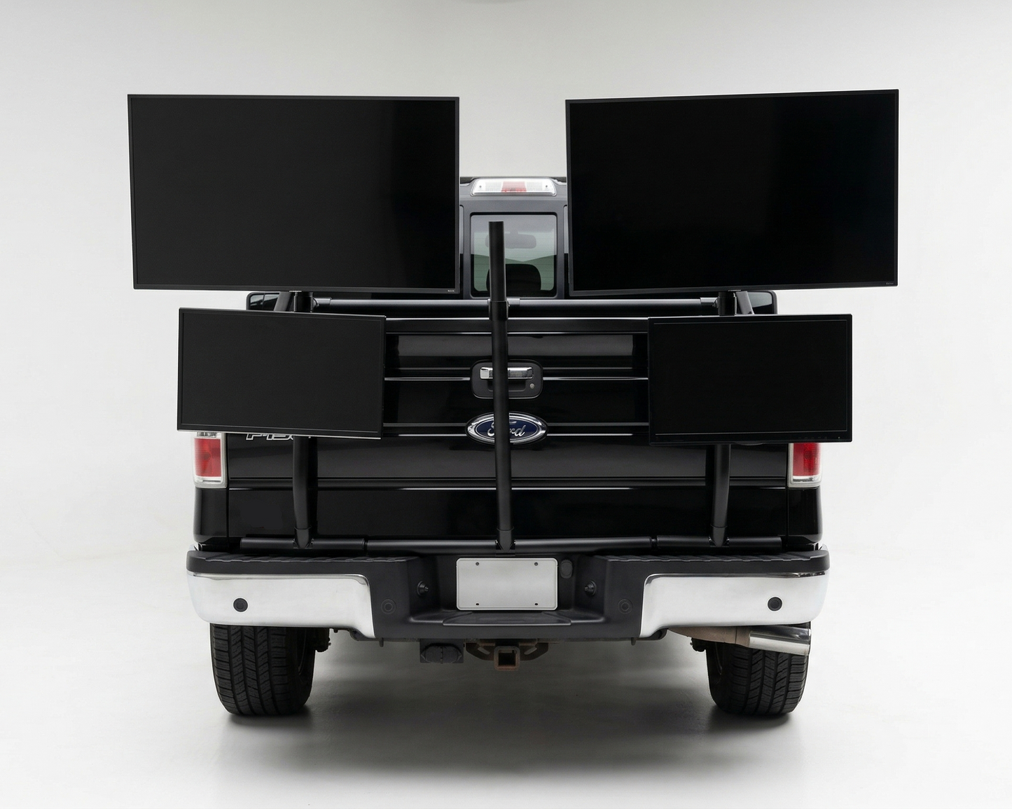 Back of a truck with a black PVC TV platform on a white background