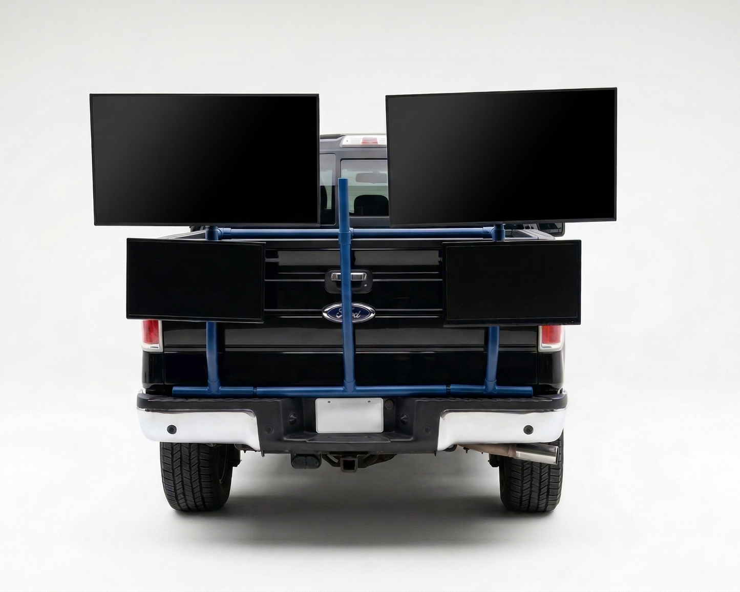 Back of a truck with a blue PVC TV platform on a white background