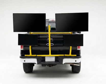 Back of a truck with a yellow PVC TV platform on a white background